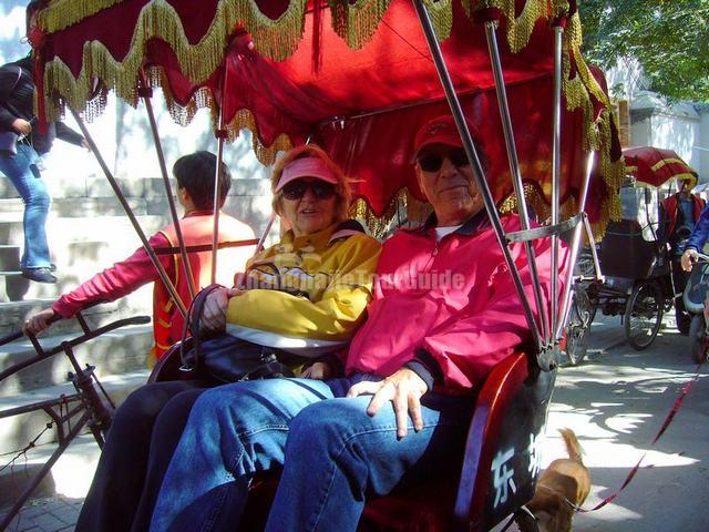 Foreign Visitors Visit Beijing Alley by Rickshaw