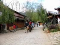 People Riding Horses at Shuhe Old Town Lijiang